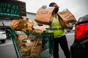 robotic-warehouses-are-being-tested-by-amazon-at-whole-foods-to-enable-customers-to-pick-up-extra-orders-at-the-cashier